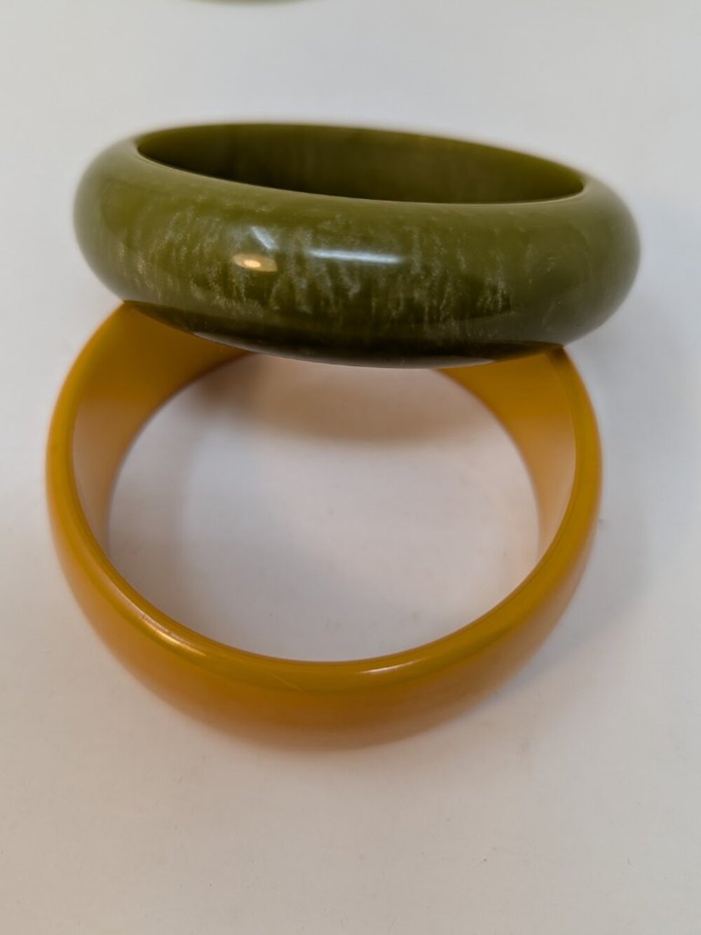 Two Art Deco Bakelite bangle bracelets in Butterscotch and Marbled Green